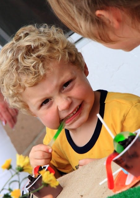 Little boy eating gummy worms