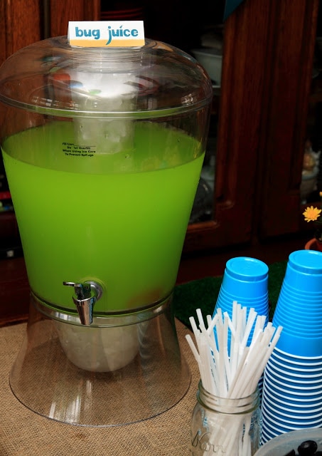Green punch with cups on a table