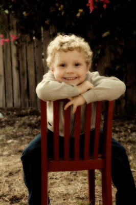 A small child sitting on a chair