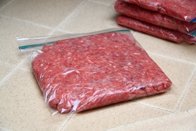 Ziploc bag of ground beef on a counter