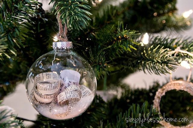 A close up of a glass ornament filled with book paper and epsom salt