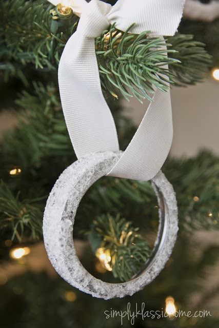 A close up of a canning jar ring ornament