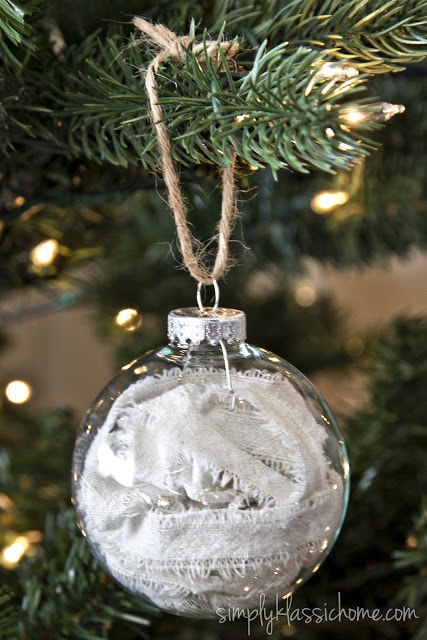 A close up of a glass ornament filled with cloth