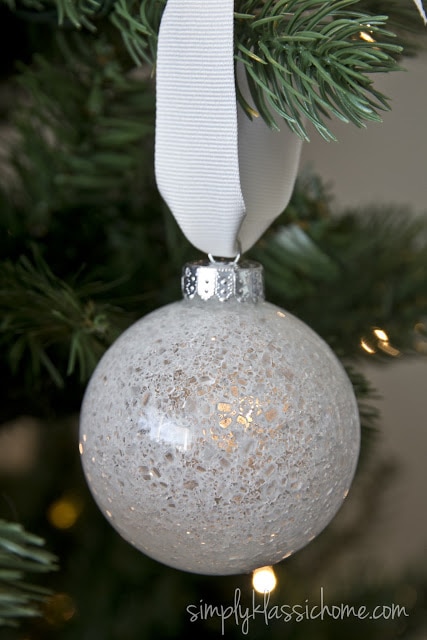 A close up of a white glass ornament 