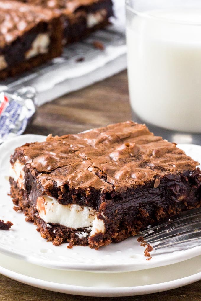 Peppermint Patty Brownies on a plate with a glass of milk.