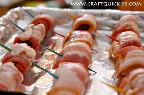 Bacon wrapped water chestnuts on a sheet pan