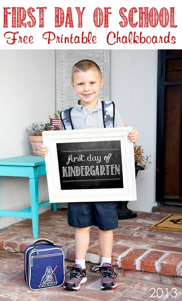 A child holding a first day of school sign for kindergarten.