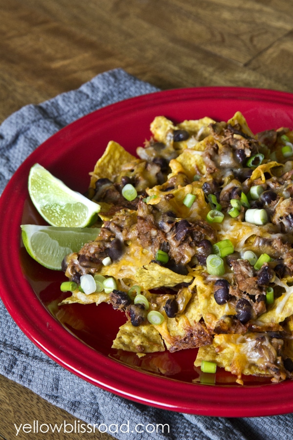 Shredded beef and black bean nachos! Create an easy Mexican meal or snack with just a minutes and a few ingredients. The perfect snack for Cinco de Mayo!! Shredded beef and black bean nachos! Create an easy Mexican meal or snack with just a minutes and a few ingredients. The perfect snack for Cinco de Mayo!!