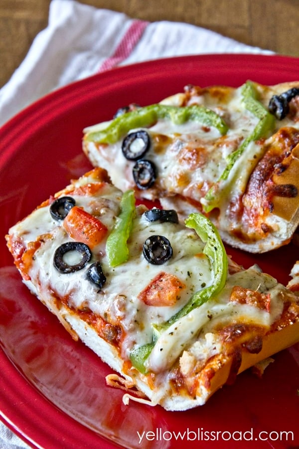 A plate of french bread pizza