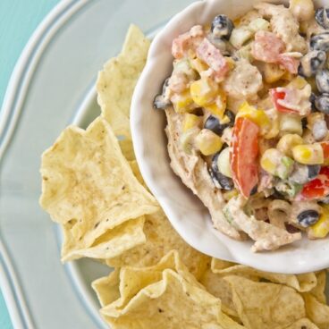 A plate of Southwest Chicken Dip and chips