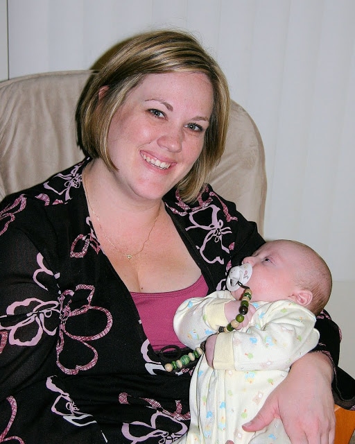 A woman holding a baby