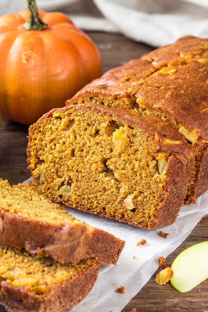 This Pumpkin Apple Bread is ridiculously moist and tender with all of those favorite warm fall flavors you love in the cool fall and winter months. A loaf of Pumpkin Bread with apples.