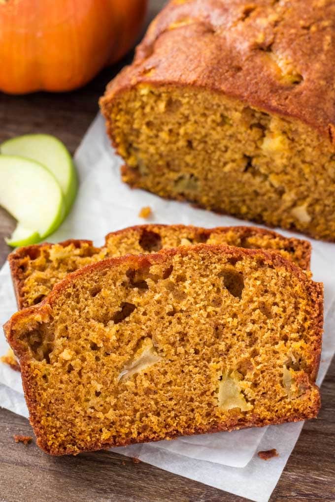 This Pumpkin Apple Bread is ridiculously moist and tender with all of those favorite warm fall flavors you love in the cool fall and winter months. Two slices of Pumpkin Apple Bread.