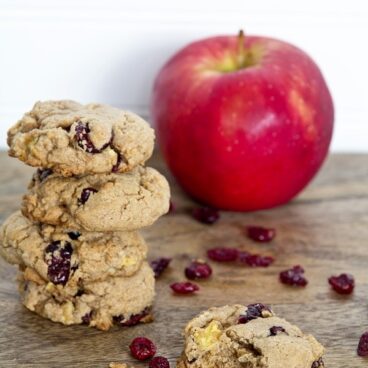 Stack of cookies next to an apple