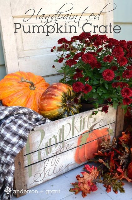 Pumpkins and pumpkin sign with flowers