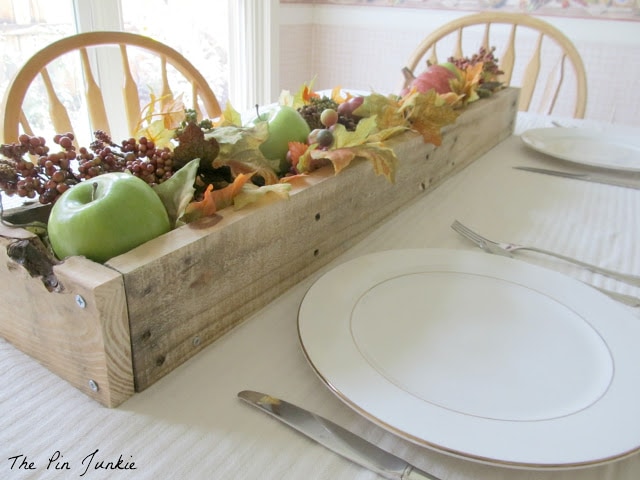 Dining table with planter box and decor