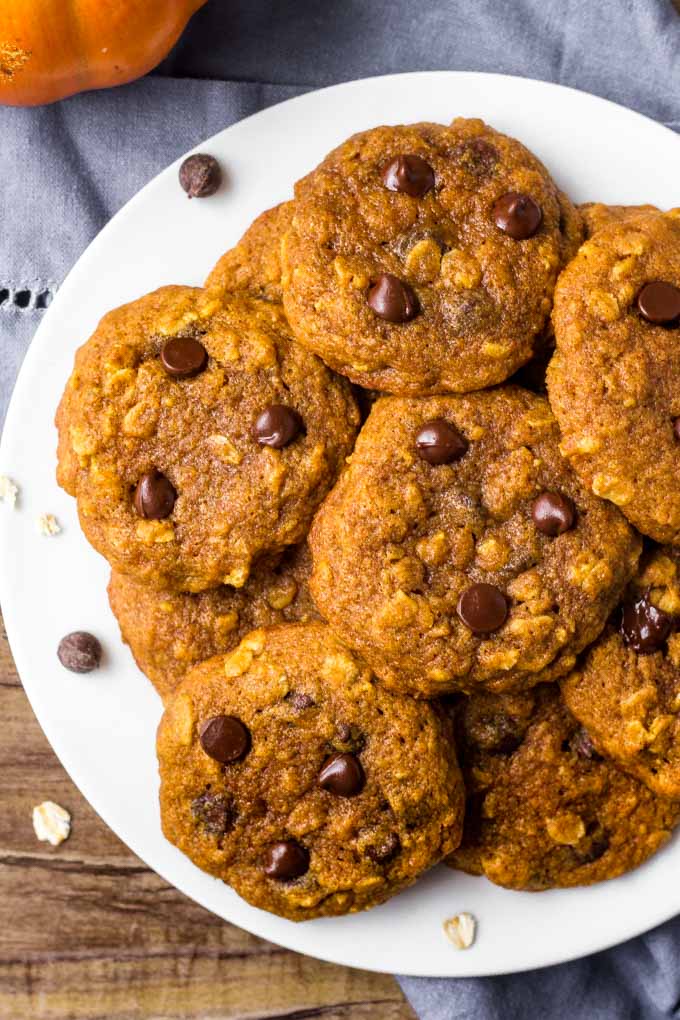 A plate of Oatmeal Pumpkin Chocolate Chip Cookies on a white plate.