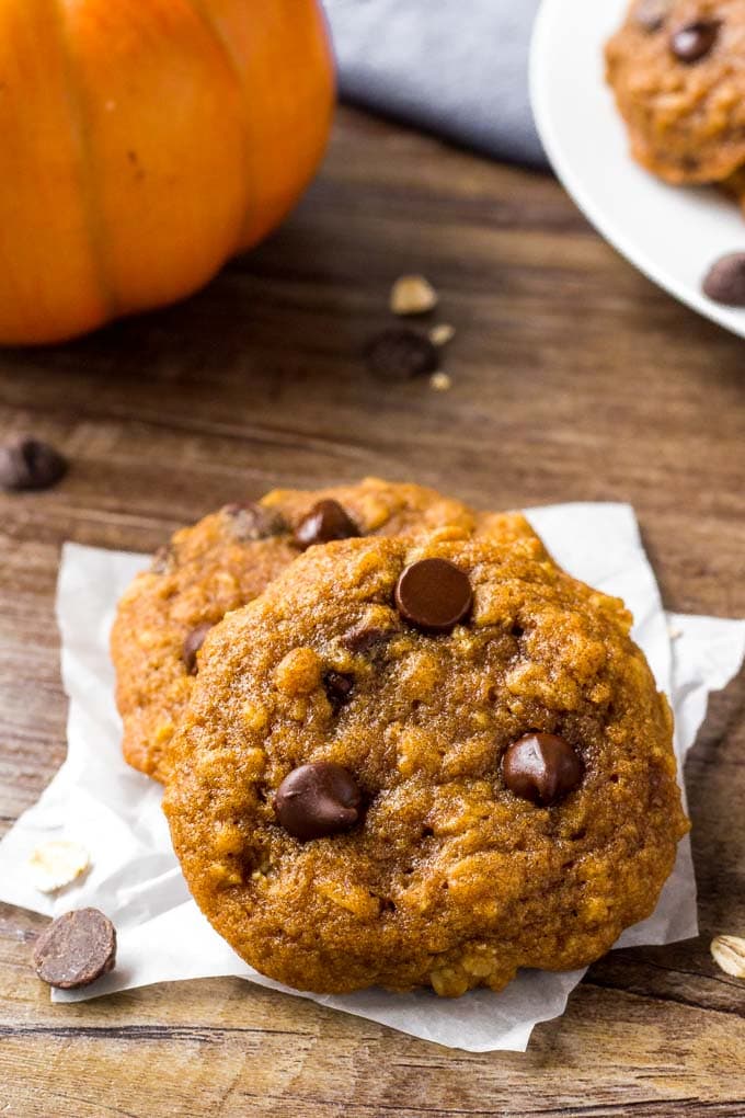 Two Oatmeal Pumpkin Chocolate Chip Cookies stacked together.