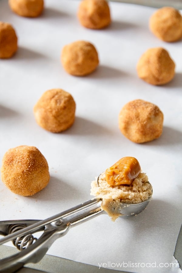 Caramel Stuffed Snickerdoodles take the classic sugary, cinnamony cookie to a whole other level. They are super soft with an ooey, gooey caramel surprise in the middle.