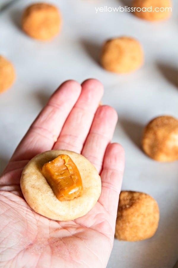 Caramel Stuffed Snickerdoodles take the classic sugary, cinnamony cookie to a whole other level. They are super soft with an ooey, gooey caramel surprise in the middle.