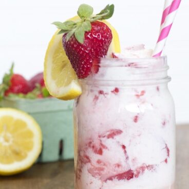A glass of strawberry lemonade ice cream float