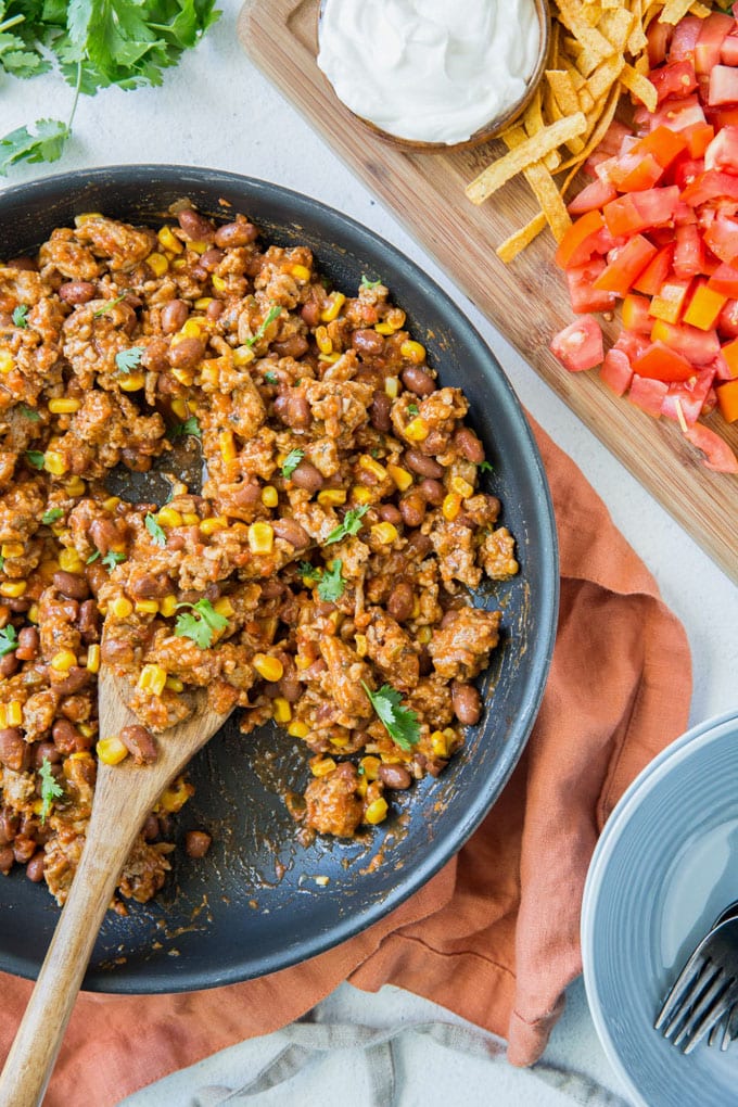 Pan filled with turkey taco meat with corn