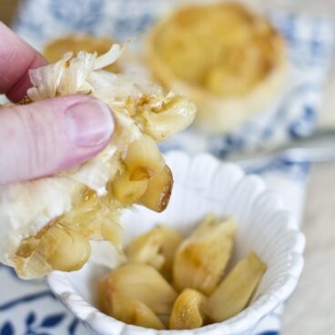 Roasted garlic in a white dish