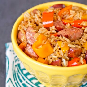 A bowl of sausage, rice, and peppers