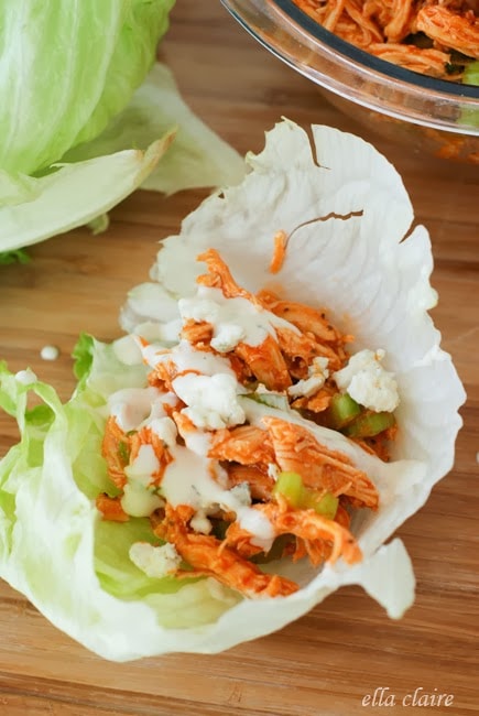 A close up of a lettuce wrap with chicken