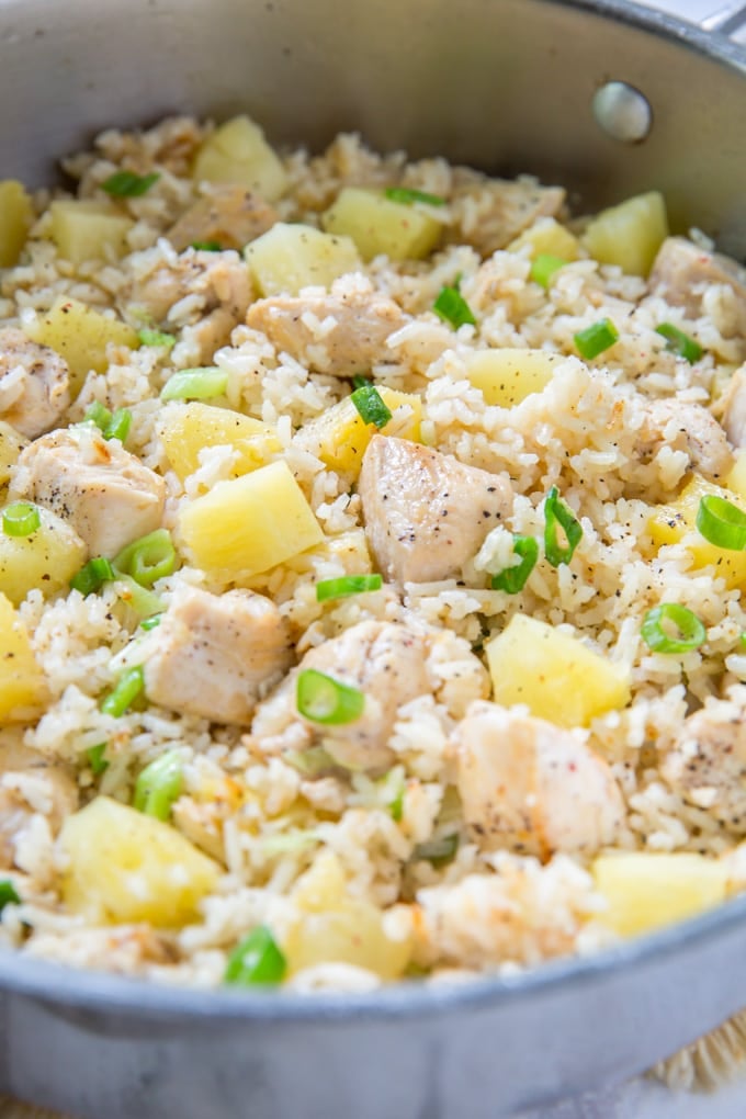 A bowl filled with Chicken, Rice, and Pineapple