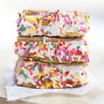 A close up of ice cream sandwiches with sprinkles
