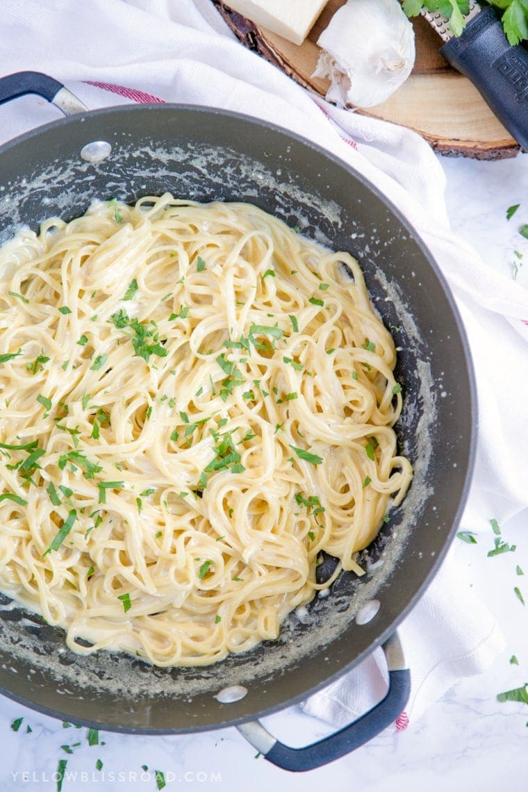 One Pan Garlic Parmesan pasta is light enough to serve as a main dish, or as a side dish. It's a simple one pot pasta that's ready in 20 minutes! Creamy Parmesan Garlic One Pan Pasta