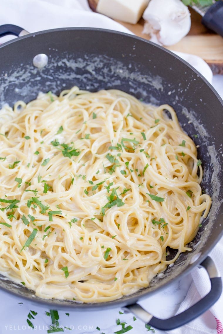 garlic parmesan linguine in a large skillet with parsley