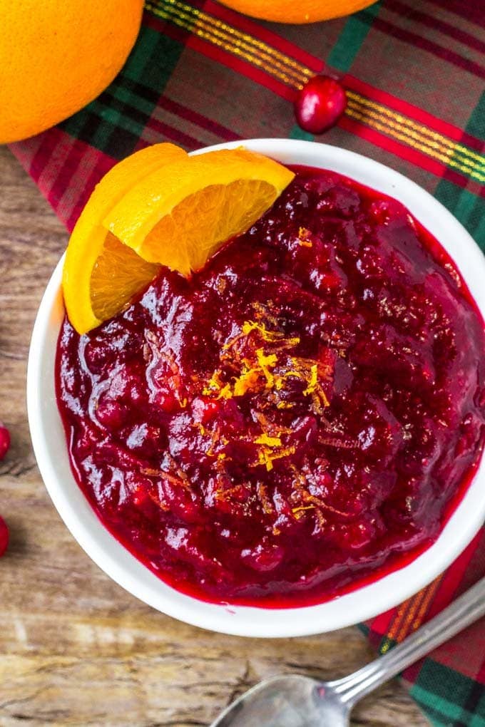 A bowl of homemade cranberry orange sauce in a white dish.