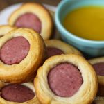 Sausage bites with a bowl of dip