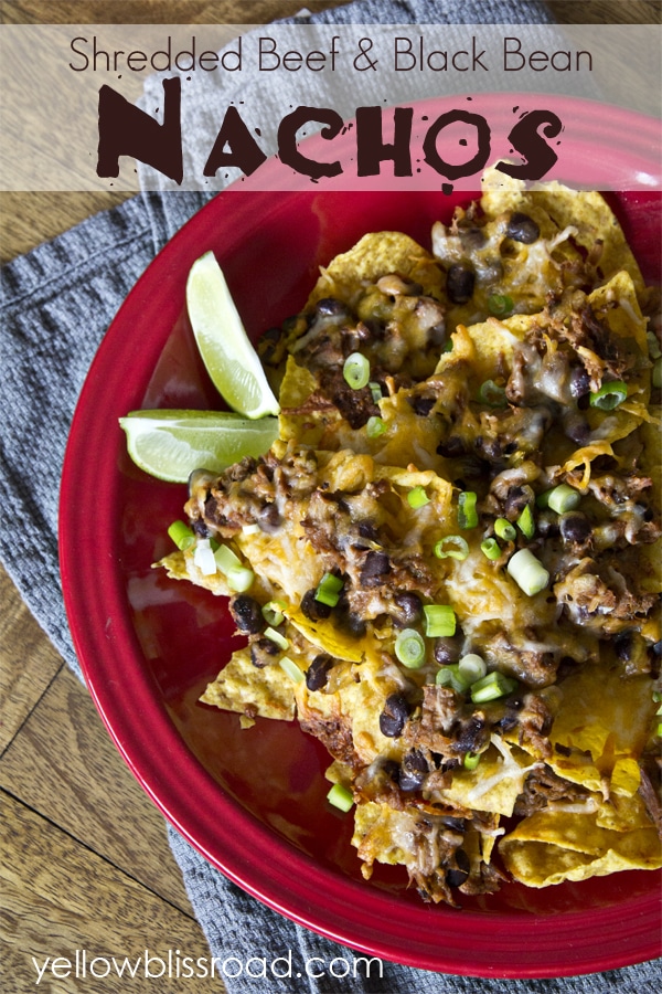 Shredded beef and black bean nachos! Create an easy Mexican meal or snack with just a minutes and a few ingredients. The perfect snack for Cinco de Mayo!!