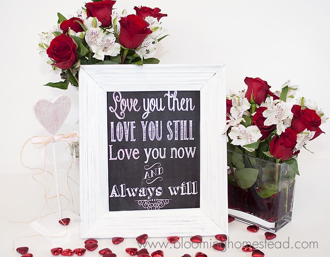 A vase of flowers on a table and Valentine\'s chalkboard printable