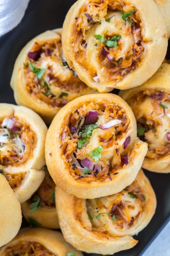 pinwheels made from pizza dough filled with bbq chicken, cheese, onions and cilantro.