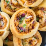 A close up of BBQ chicken stuffed pinwheels.