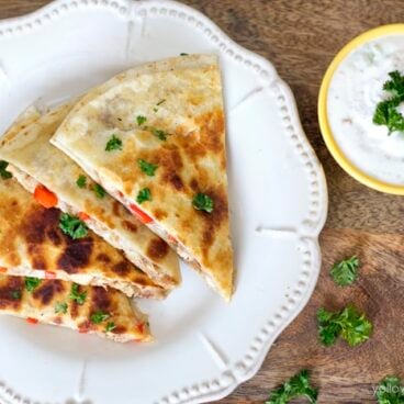 A plate of quesadillas on a table