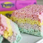 Rice krispie treats with layered colors of pink, yellow, purple, and blue.