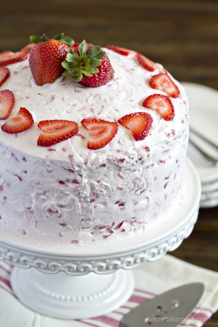 whole 3 layer round cake with strawberry frosting