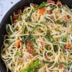 A bowl of asparagus and pasta, with Bacon