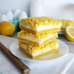 A stack of lemon bars on a plate
