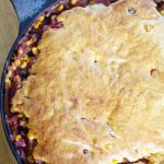 A pan with chili and cornbread