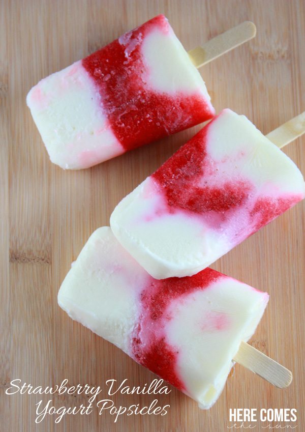 Strawberry vanilla popsicles on a table
