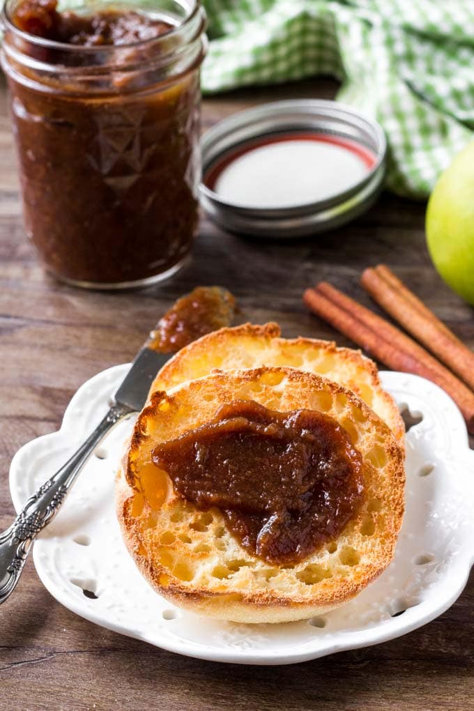 My Easy Crockpot Apple Butter Recipe is simple and cooks overnight in your crockpot! It's creamy and sweet and a healthier alternative to jams and jellies. Apple butter spread onto an english muffin.