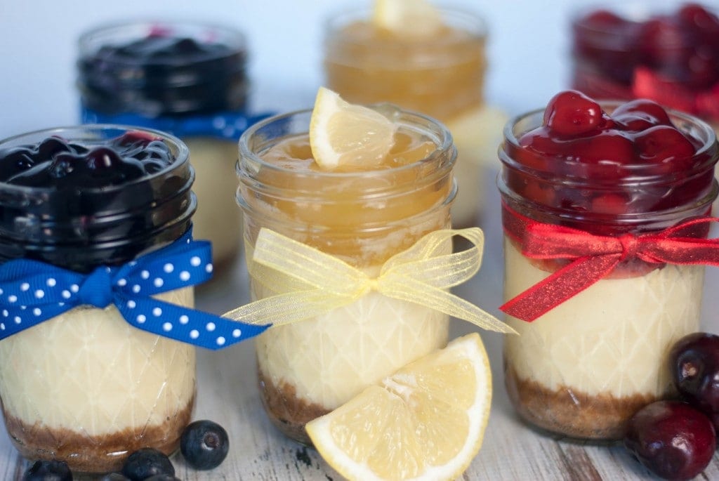 Several mini cheesecakes on a table