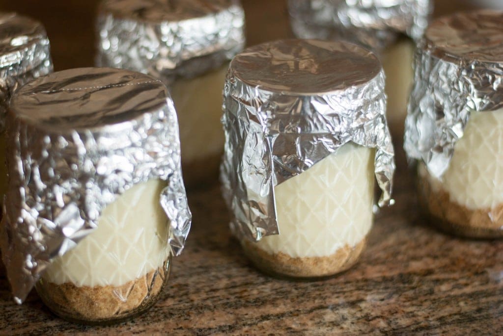 Jars of cheesecake on a table