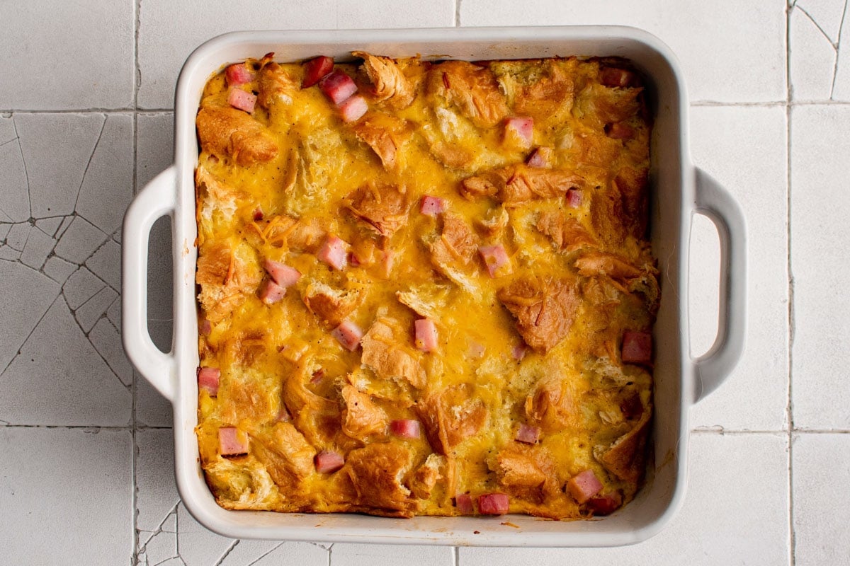 Baked and full set breakfast croissant casserole.